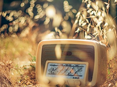 old-radio-in-dry-grass.jpg